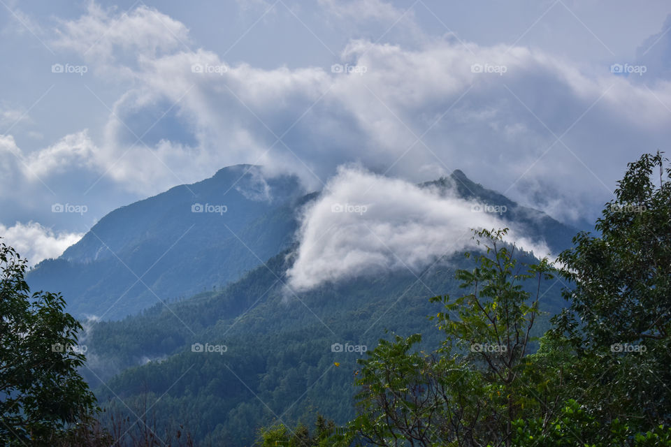 Clouds over mountain range