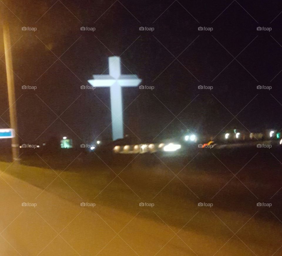 Cross along the right side of the highway
