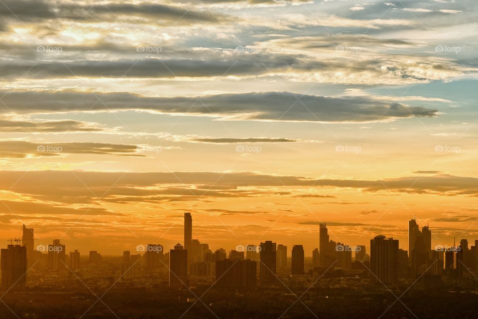 Twilight and fog cover skyscraper scape after rain in Bangkok Thailand