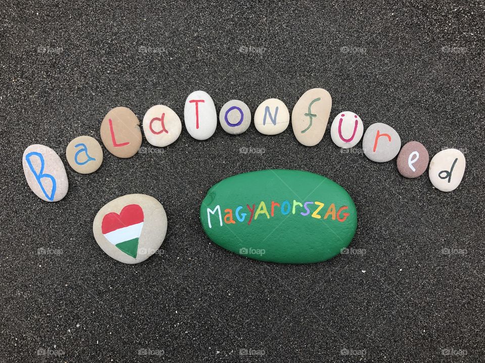 Balatonfüred lake, Magyarorszag, Hungary, souvenir with carved stones over black volcanic sand 