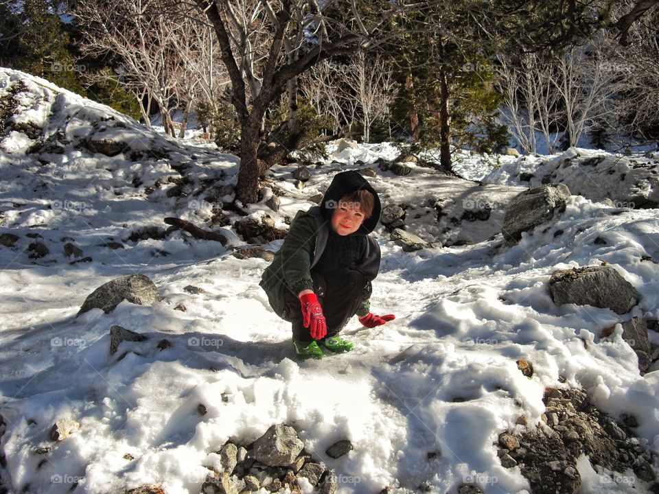 Boy Playing In The Snow
