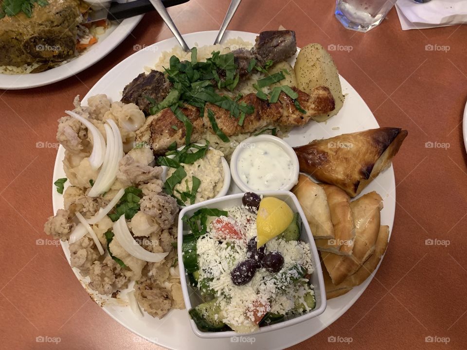 Lets eat- Plate gull with samples of Greek food, salad rice souvlaki tzatziki..delicious 😉