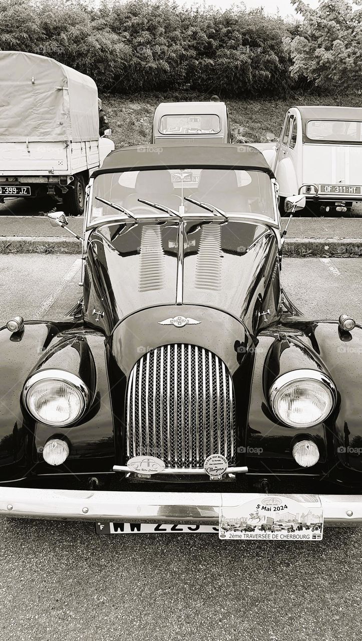 Sepia shot of the front of a Morgan Convertible at Cherbourg car show