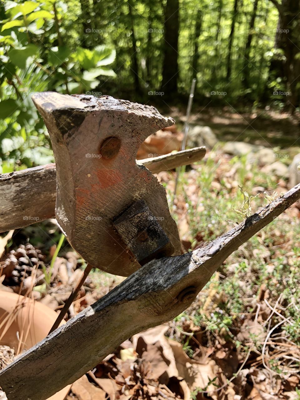 Vintage wooden cardinal garden ornament weathered and peeling paint 