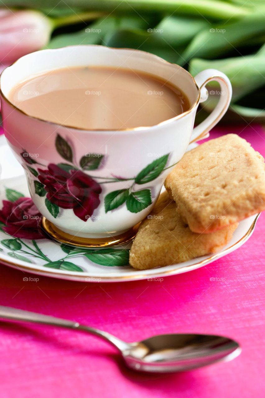 Cup of tea with shortbread cookie. Cup of tea and saucer with shortbread cookie biscuit 