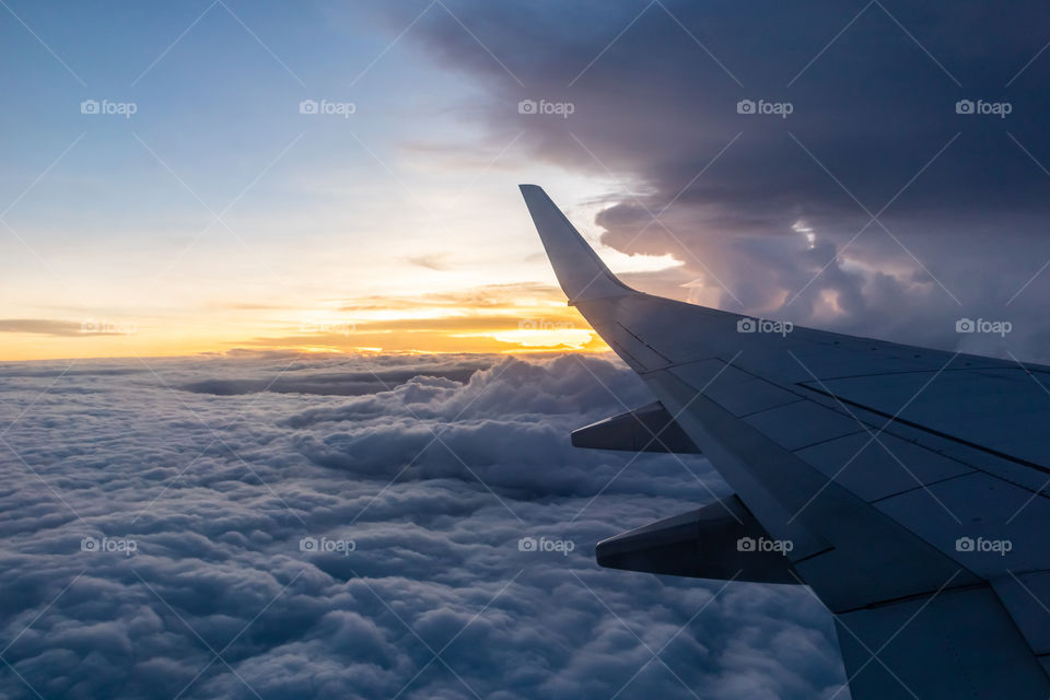 Sunset on airplane flying