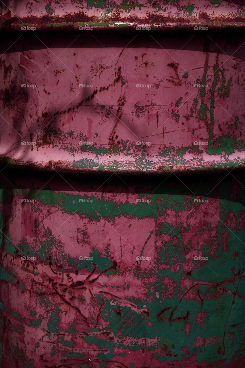 Magenta on metal, magenta trash can in the park, magenta is the color of the year, paint scraped up