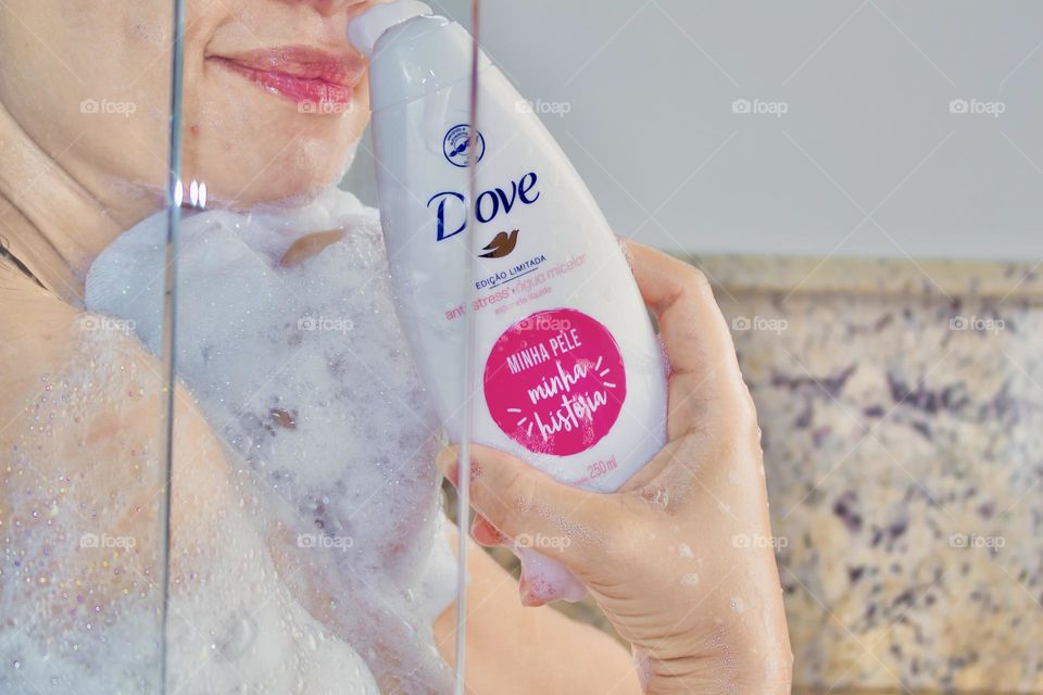 Woman using Dove body wash