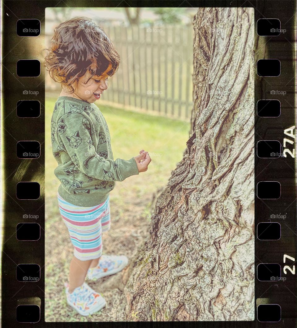 Child touching tree, toddler in nature, toddler discovering nature