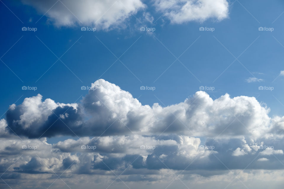 Blue sky and fluffy clouds