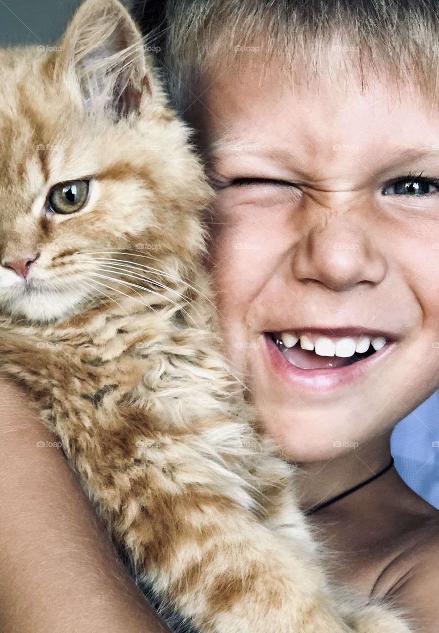 Cute boy with amazing cat