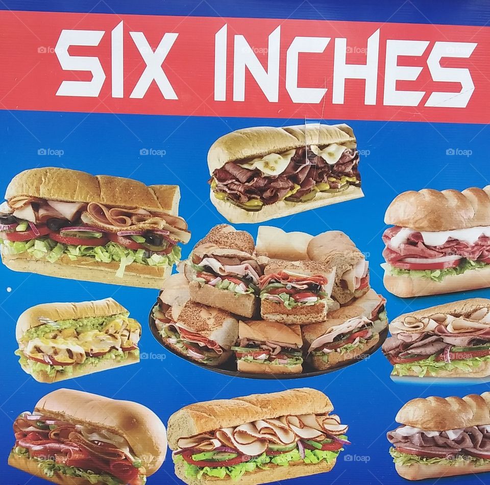 Six inch sandwiches for sale on the go of all kind.