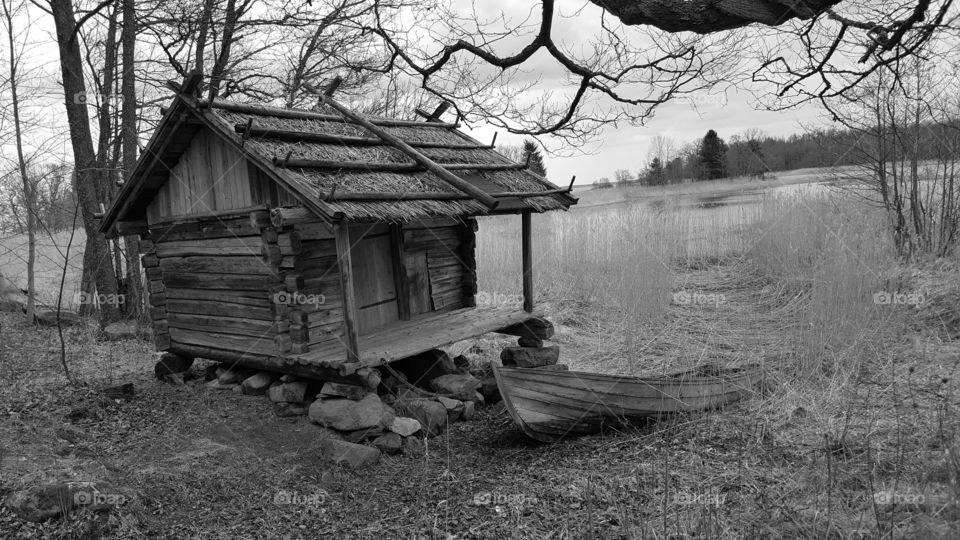 Black and White house and a boat