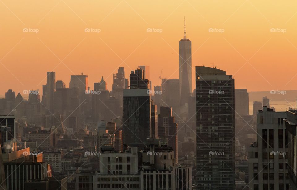 Manhattan skyscrapers at colorful sunset 