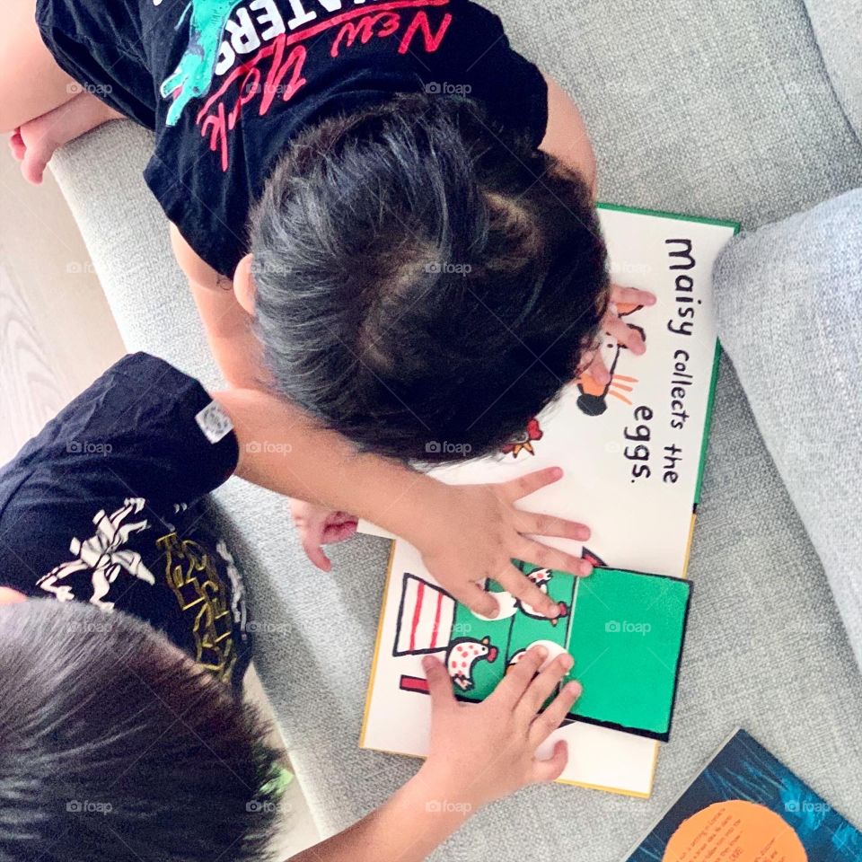 Children reading books on weekend