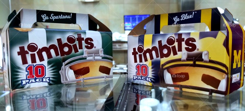 Rivals Michigan State Spartans and University of Michigan Wolverines Football Timbit boxes at Tim Hortons.