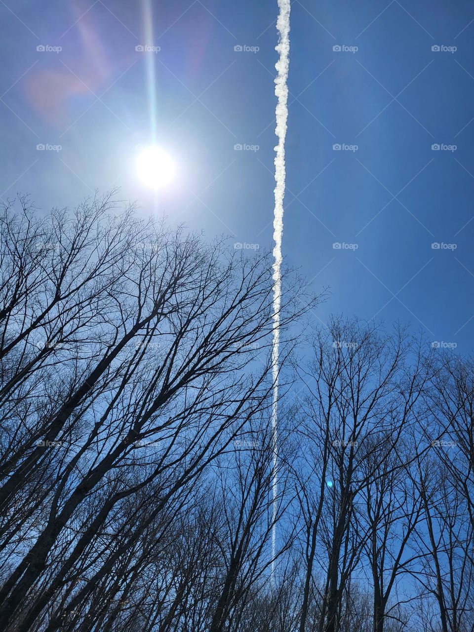 Clear blue sky chemtrail vapor trail