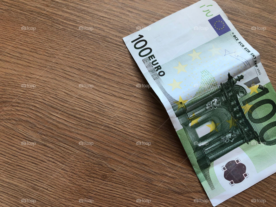 euro on wooden background