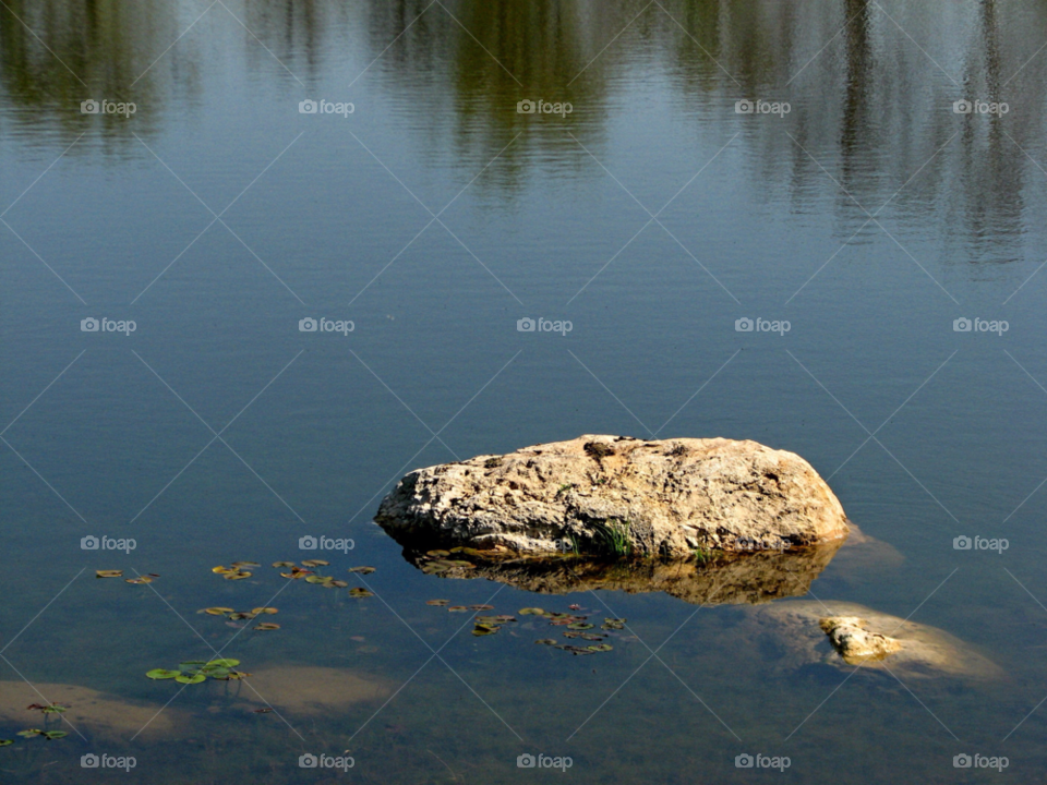 water reflection rock peaceful by landon