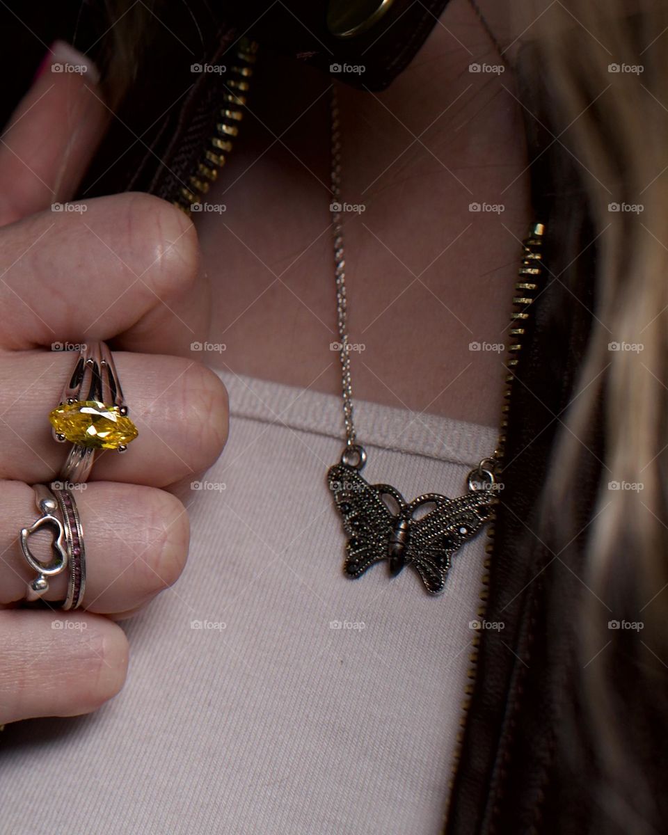 Ring stack with a butterfly necklace