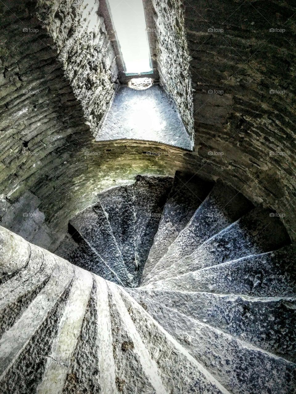Descent. Staircase in a castle near Ballylongford, Ireland