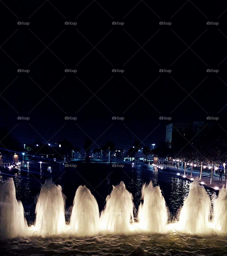 Illuminated fountain at night
