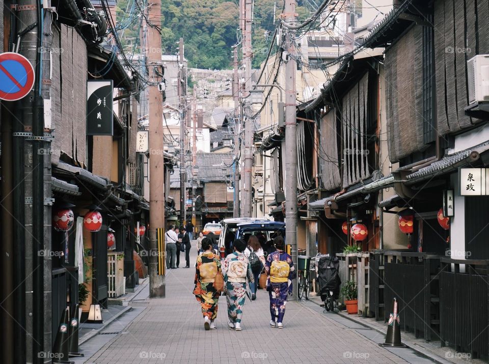 Japanese girls in kimonos walking around Kyoto