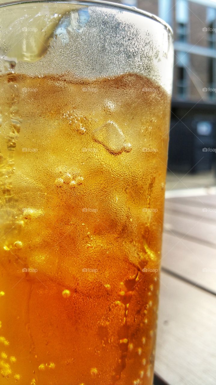 A glass of ice cold fizzy soft drink. A refreshing welcome to the warm weather.