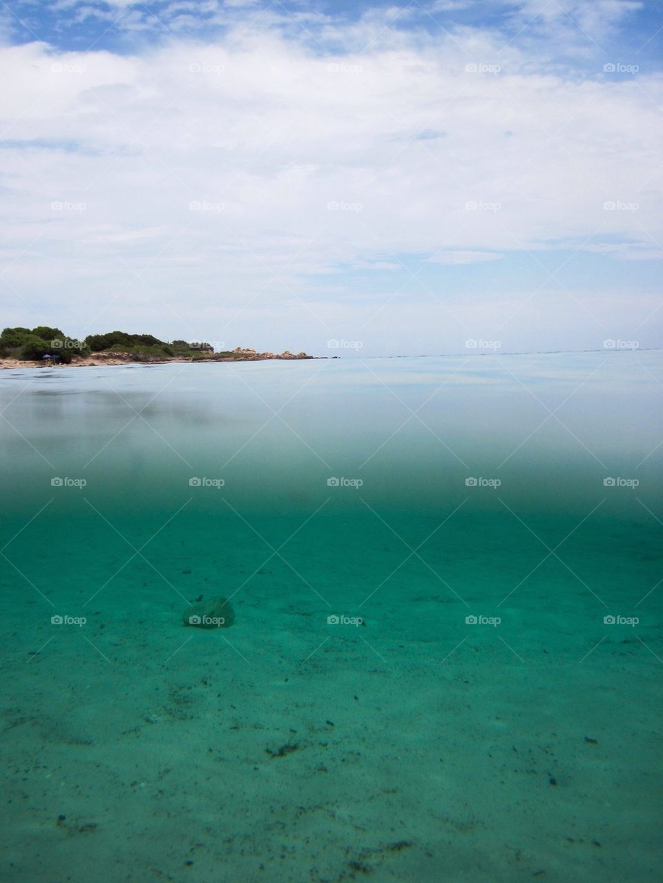 Sardinia beach half underwater have over water 