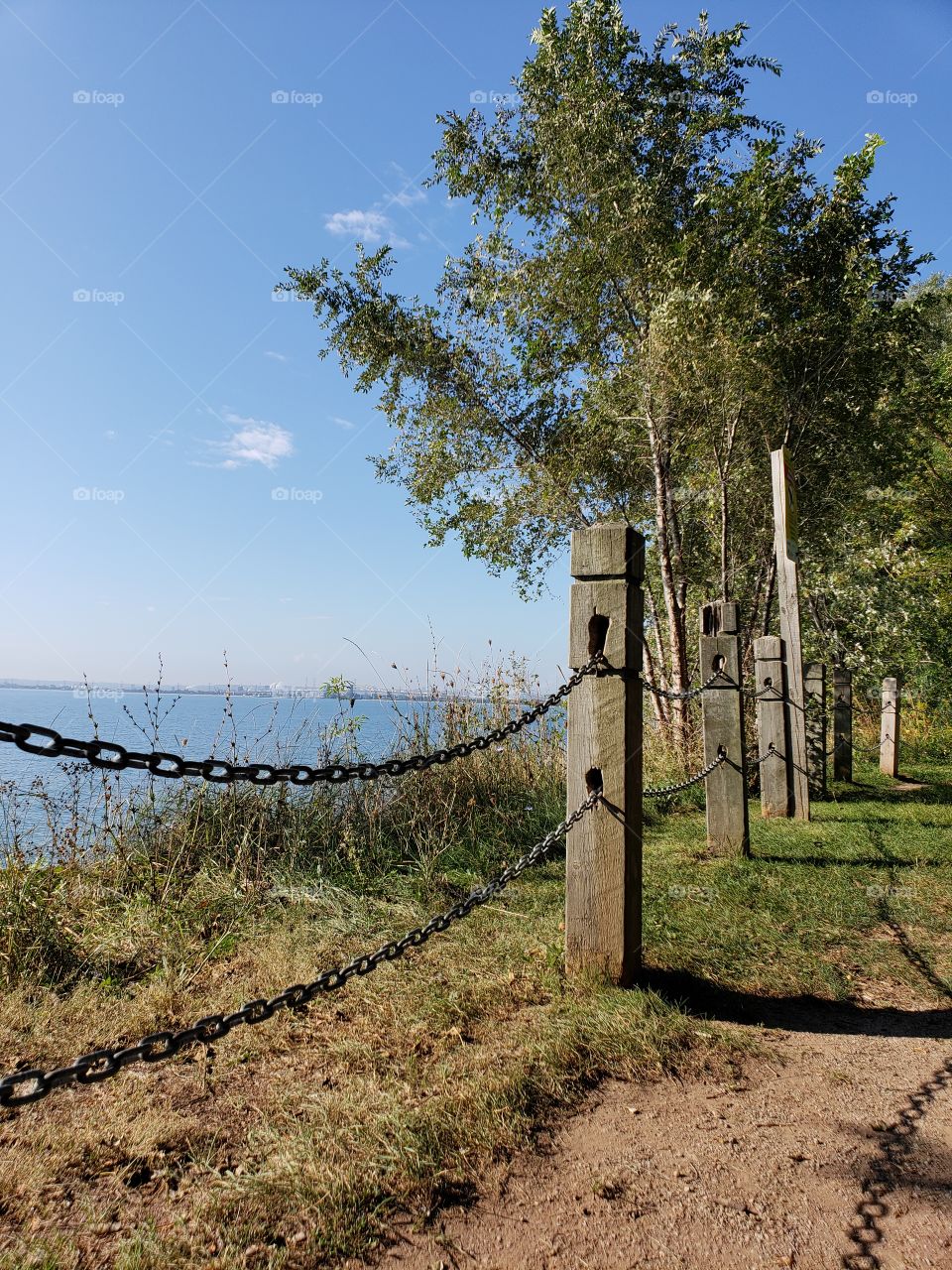 posts, Janes, trees lining a pathway beside the water