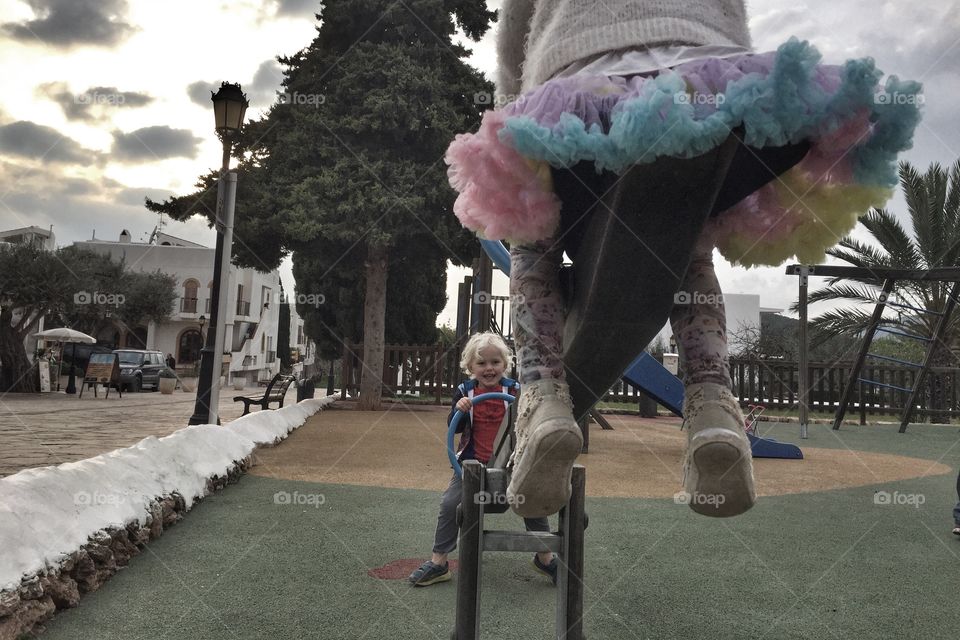 Siblings on a seesaw 