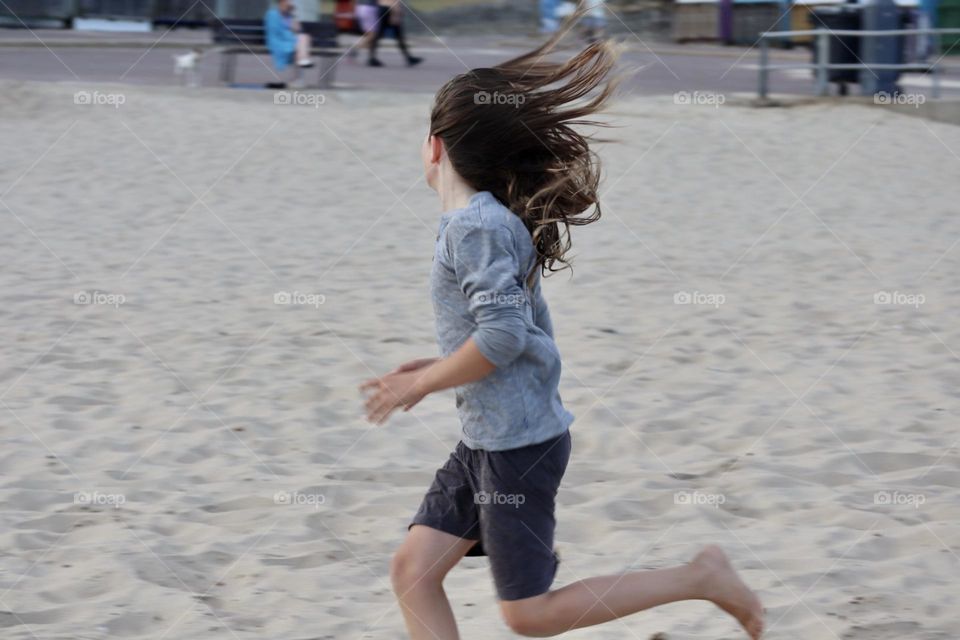 Kid run at the beach