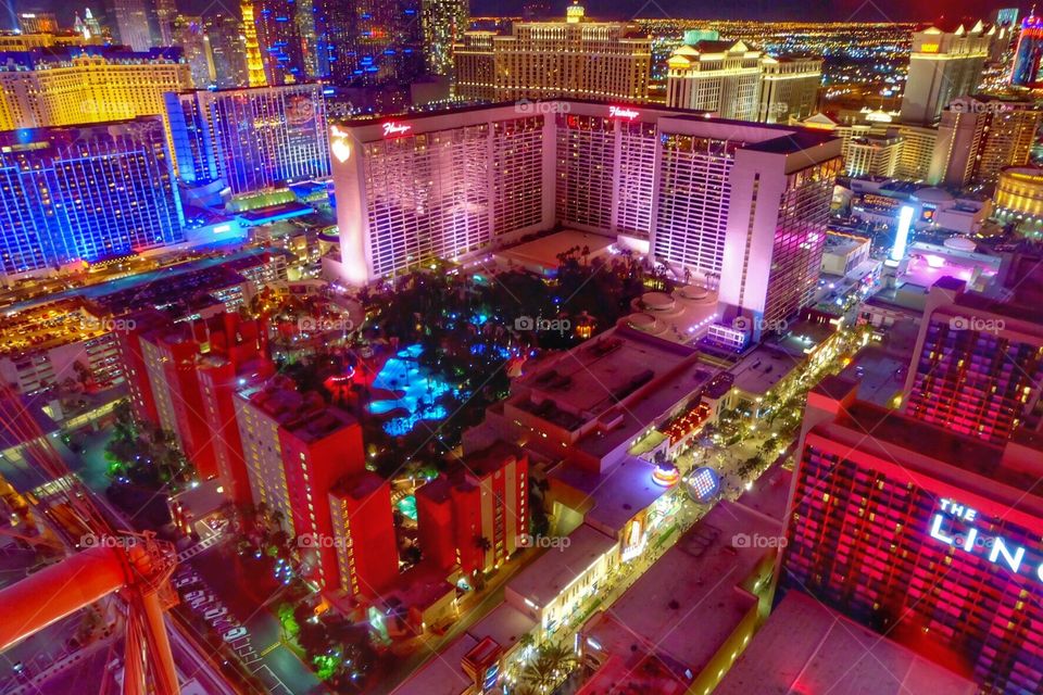 A view of the Las Vegas strip, hotels, businesses & skyline illuminated high above from The High Roller Ferris Wheel in Las Vegas, Nevada.