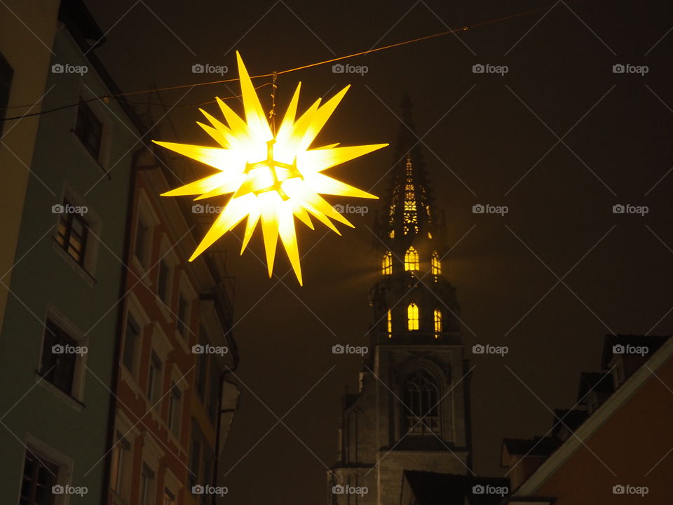 Christmas lightnings stars in front of a church