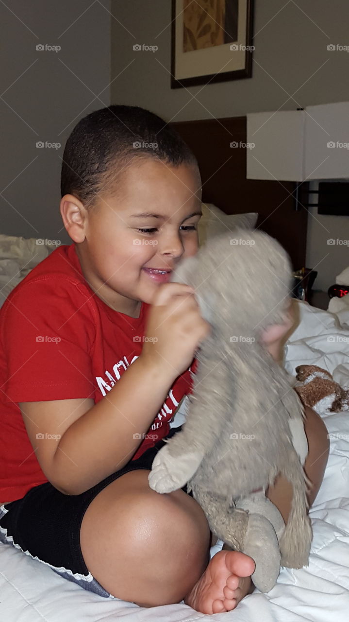 Cute boy playing with toy