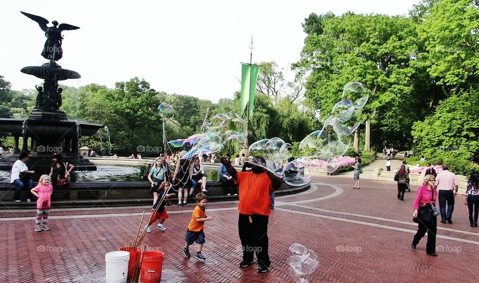 children playing with bubbles