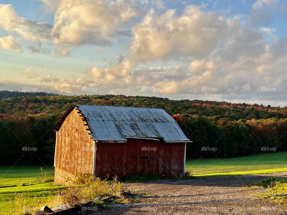 Mountainside barns in the autumn sunset in Western Maryland