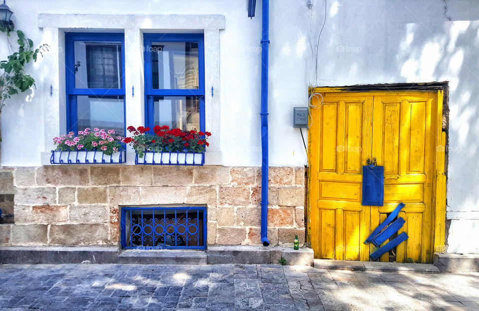 a blue window and yellow door