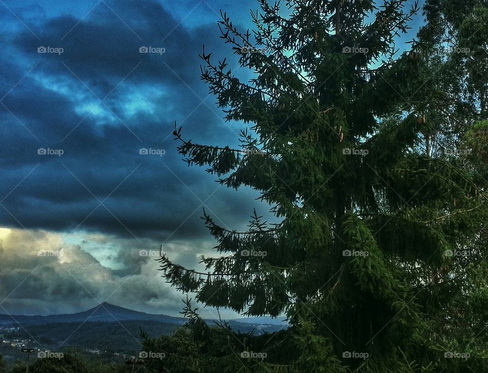 View of landscape against cloudy sky