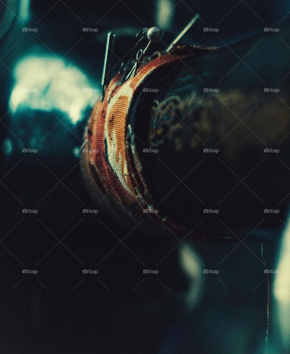 An old mechanical sewing machine with manual drive.