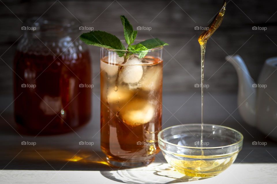 Ice tea with honey and mint drink