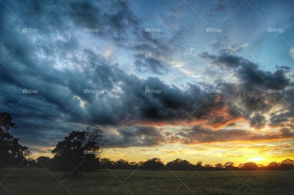 Cloud and sunset over field 