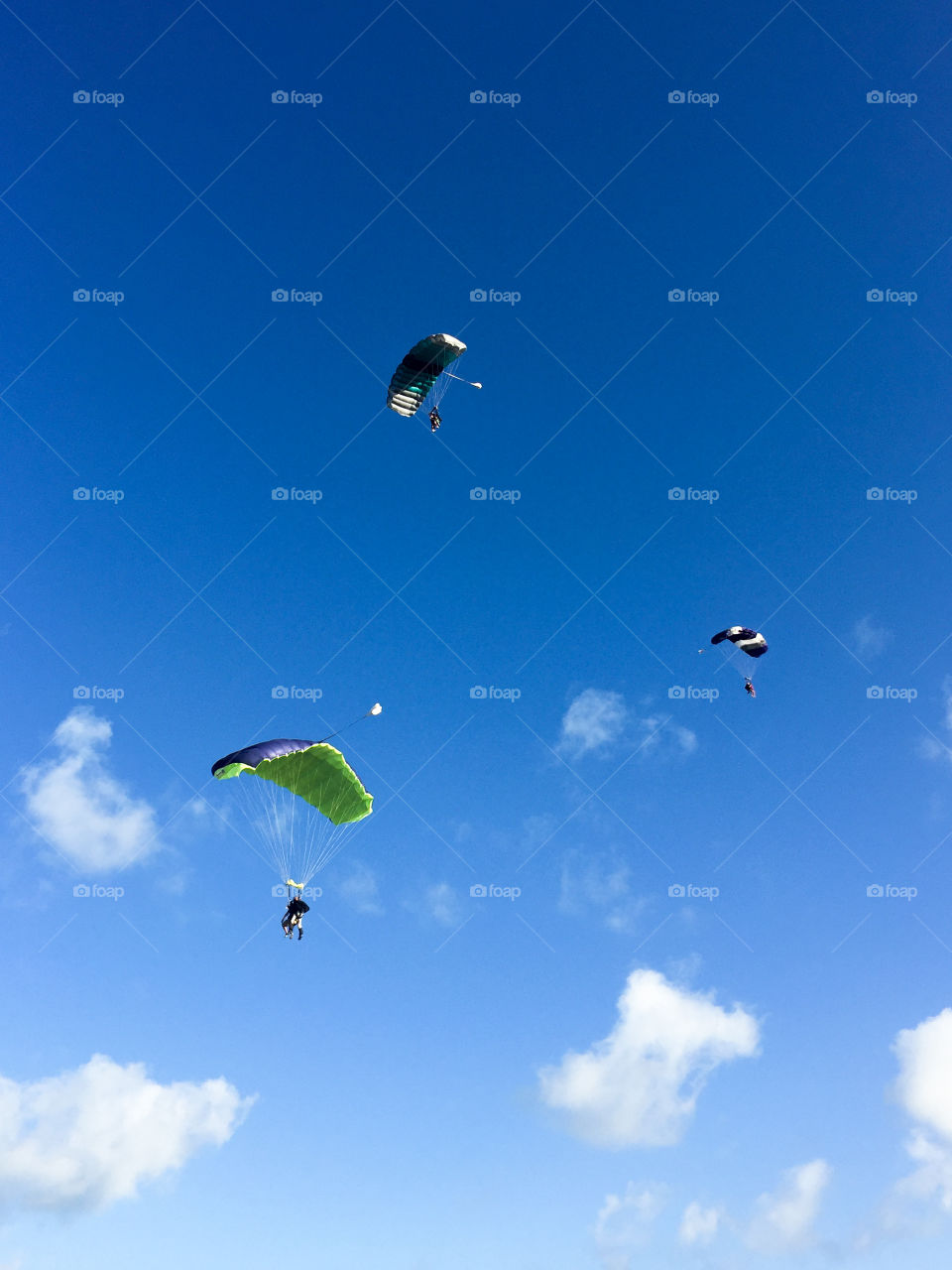 Three skydivers in the sky, Cuba, Varadero