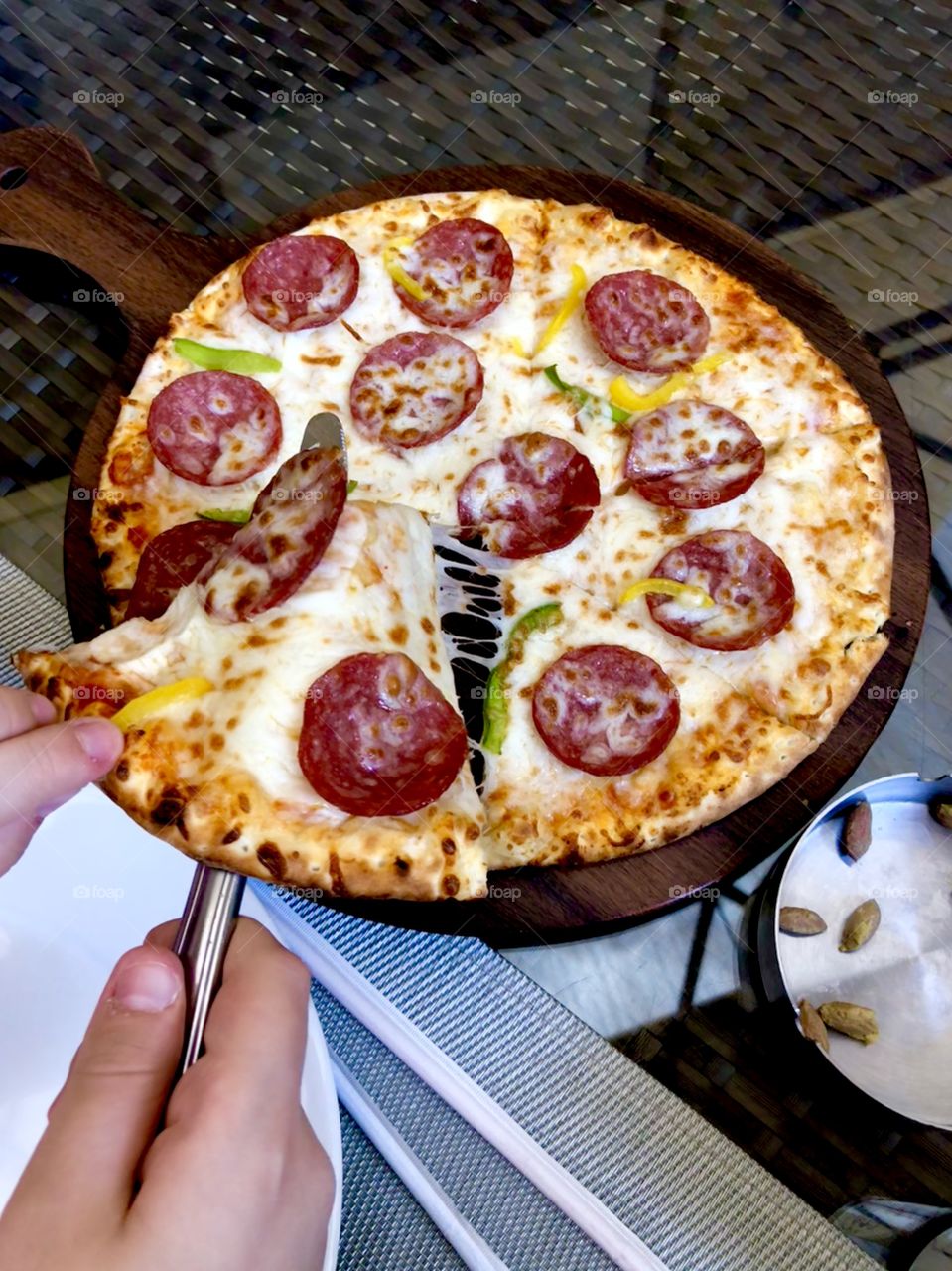 Pepperoni pizza is served 
