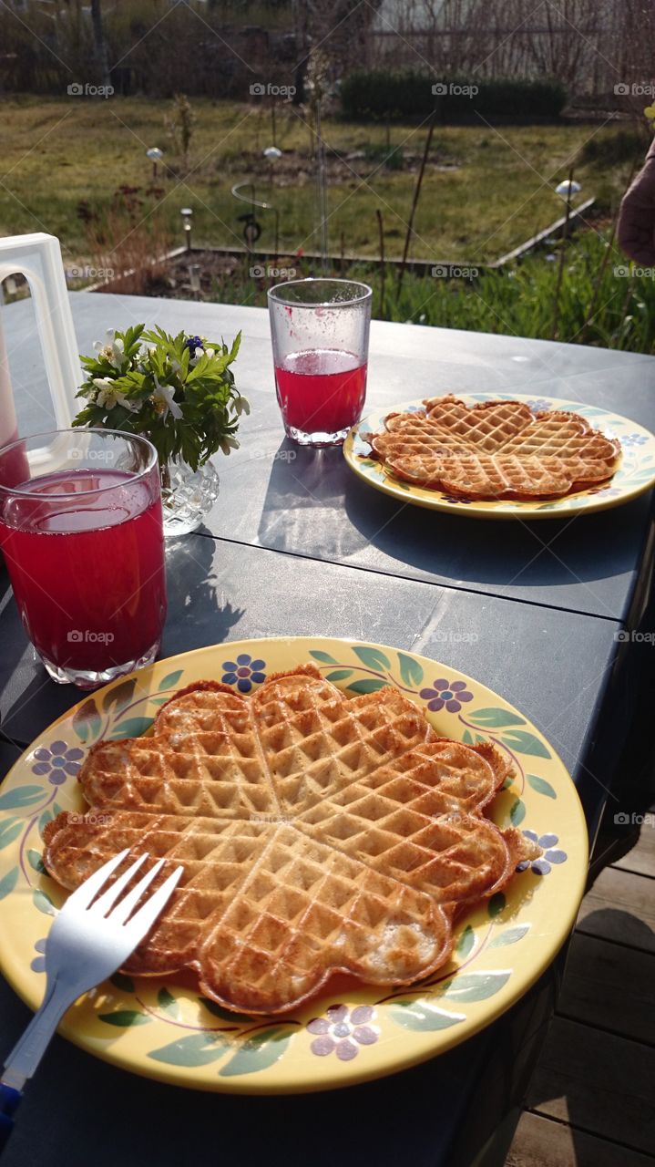 eating waffles in the garden . eating waffles in the garden 