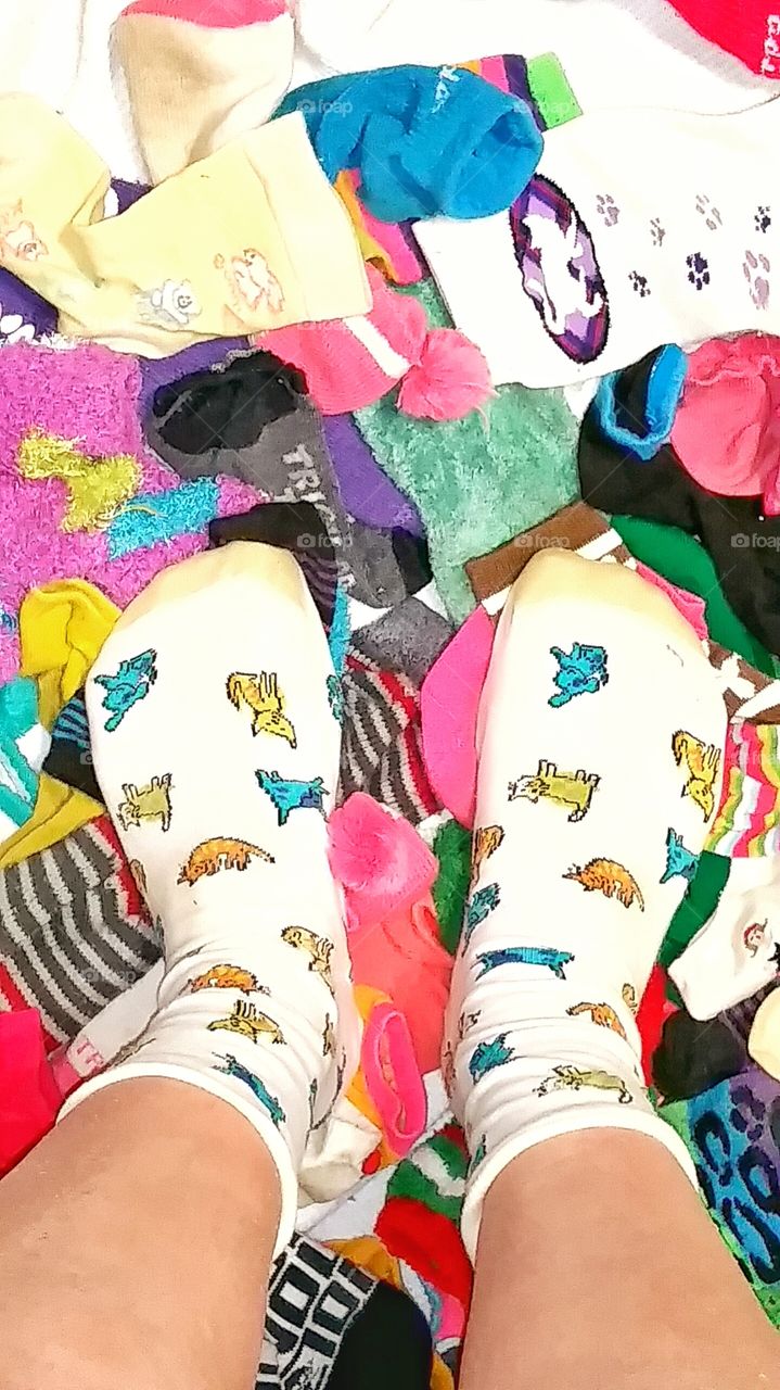 wearing socks with cat design and sock background
