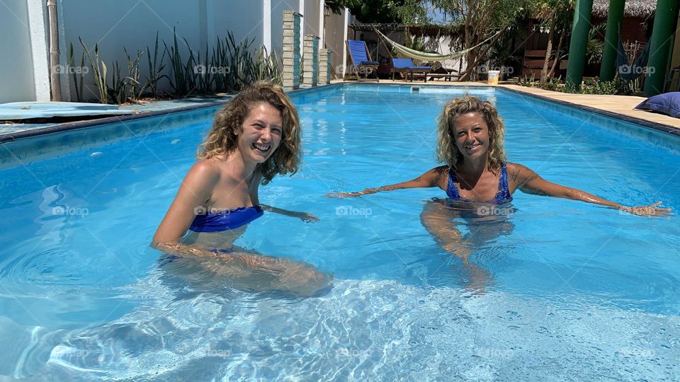 Woman Friends in swimming pool 