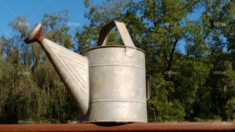 Close-up of vintage metal watering can
