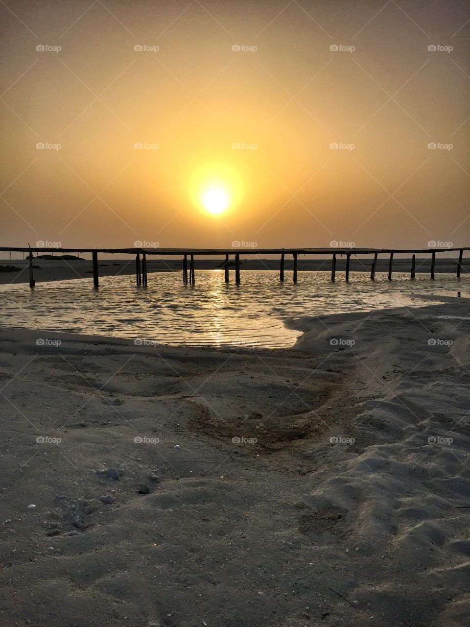 Sunset Pier. Ras Ghurab Island, Abu Dhabi, United Arab Emirates.
