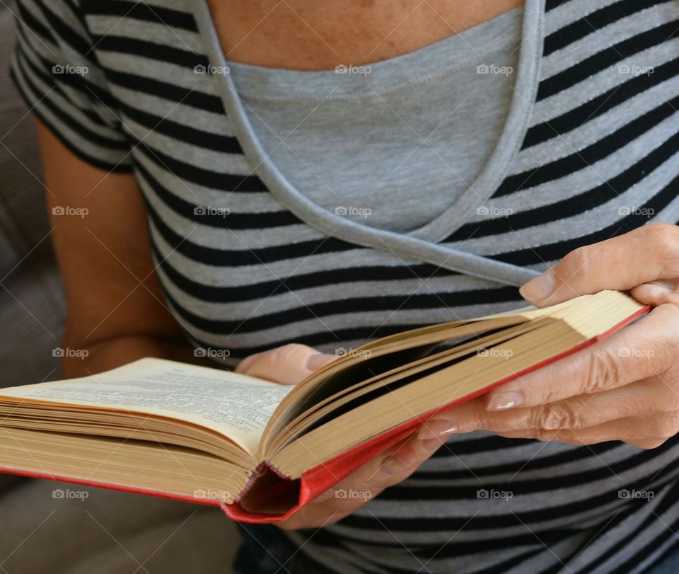 book in the female hands reading